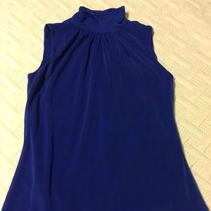 Sleeveless high neck Blouse.